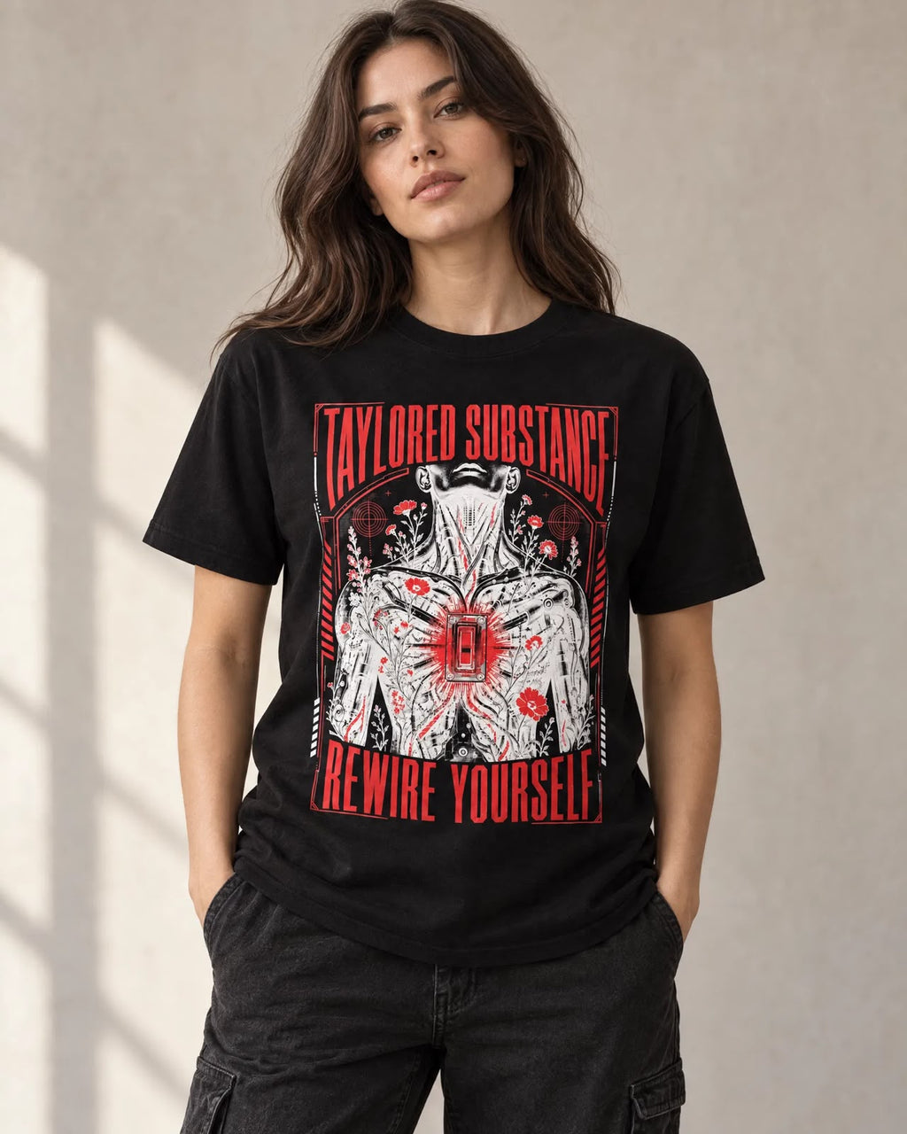 Model wearing the black Rewire Yourself graphic T-shirt with red typography and illustrated front artwork.